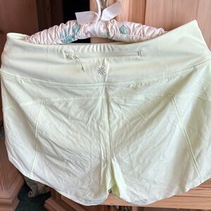 Athleta Light Yellow Athletic Shorts